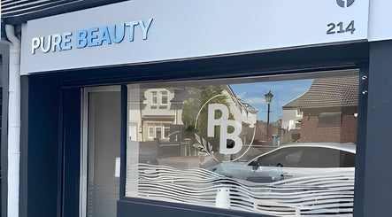 Exterior of Pure Beauty at Holytown, Scotland, GB, showcasing the sleek storefront design.