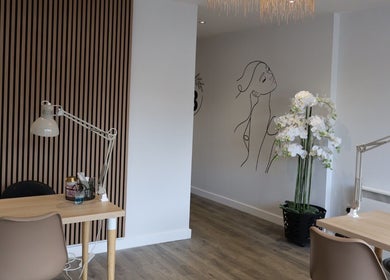 Chic interior of Pure Beauty in Holytown, Scotland, featuring modern decor and elegant workspace.