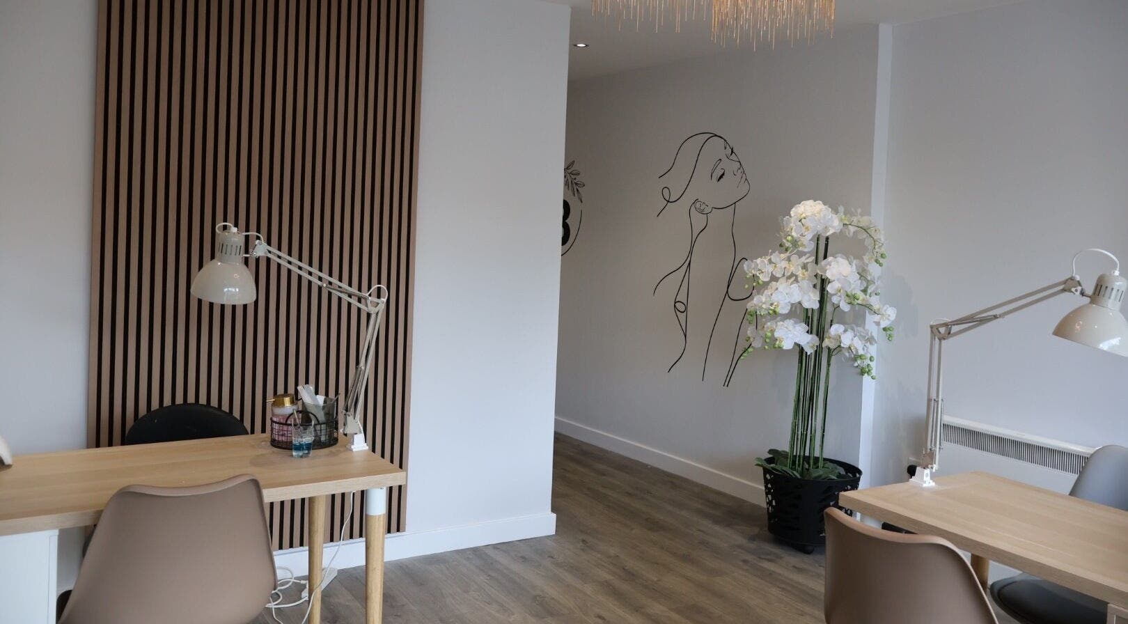 Chic interior of Pure Beauty in Holytown, Scotland, featuring modern decor and elegant workspace.