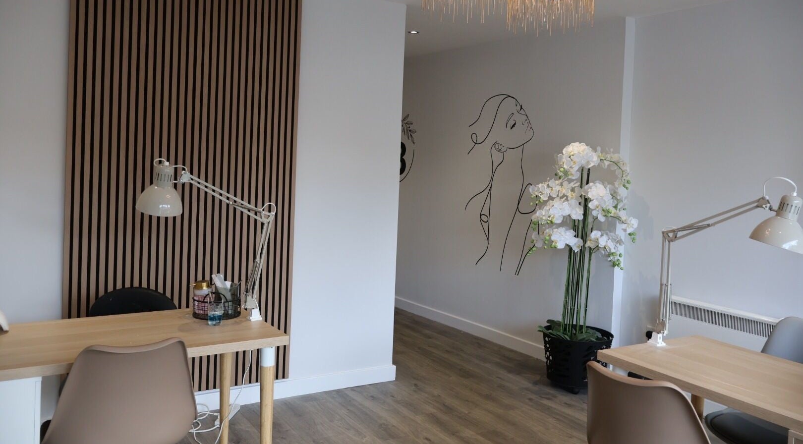 Chic interior of Pure Beauty in Holytown, Scotland, featuring modern decor and elegant workspace.
