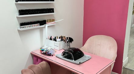 Pink nail station at Rhilaxandrhivive, Barnsley, England, GB with manicure tools and polish display.