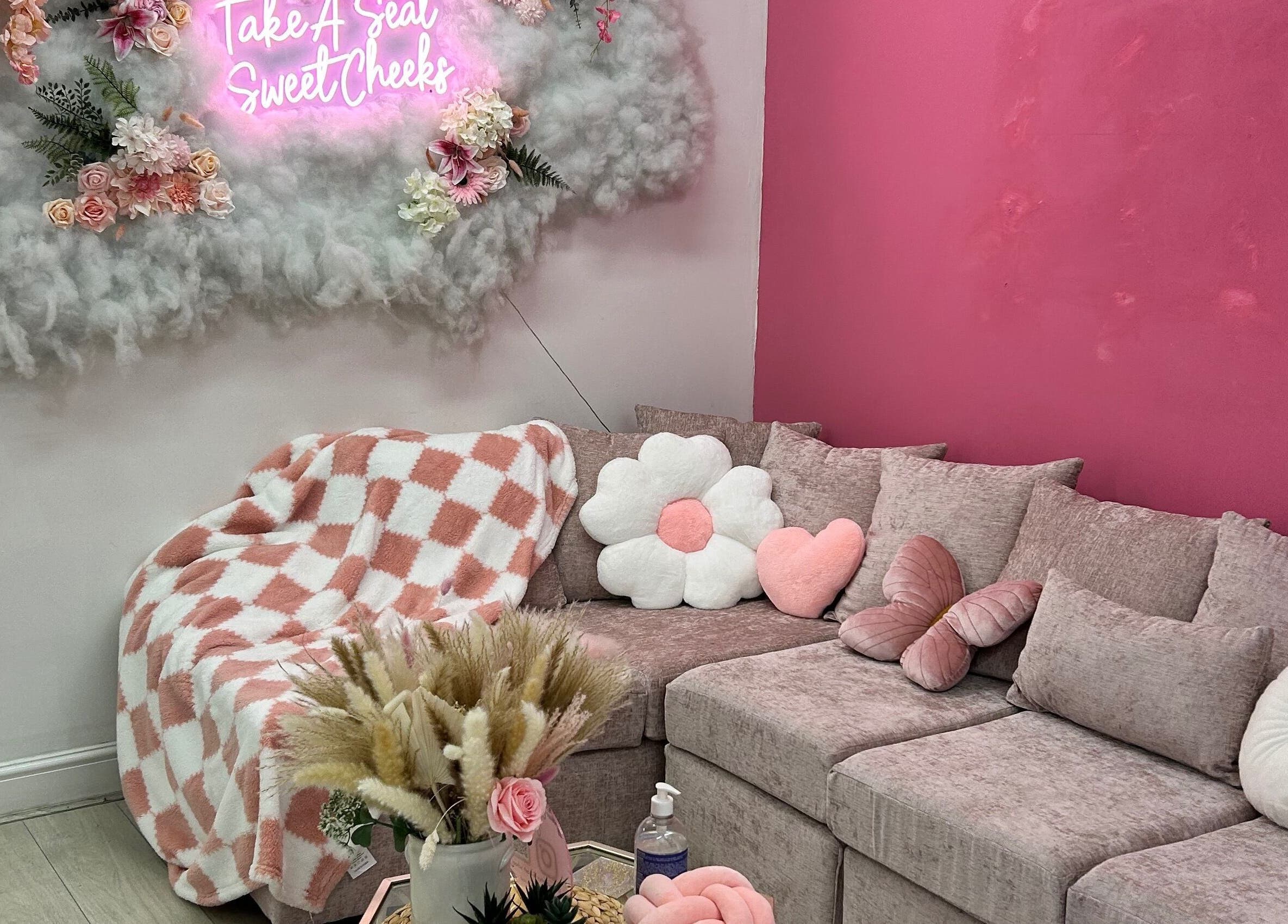 Inviting lounge at Rhilaxandrhivive, Barnsley, England, GB, with plush pillows and chic decor.