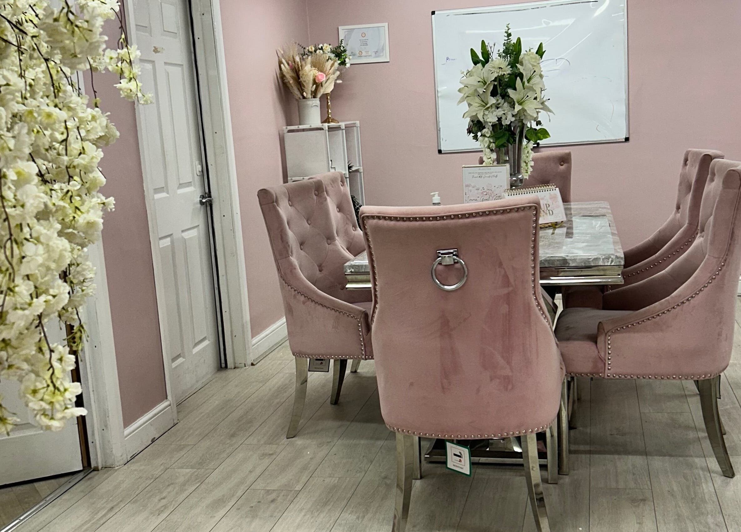 Luxurious pink meeting room at Rhilaxandrhivive, Barnsley, England, GB, featuring stylish seating and floral decor.