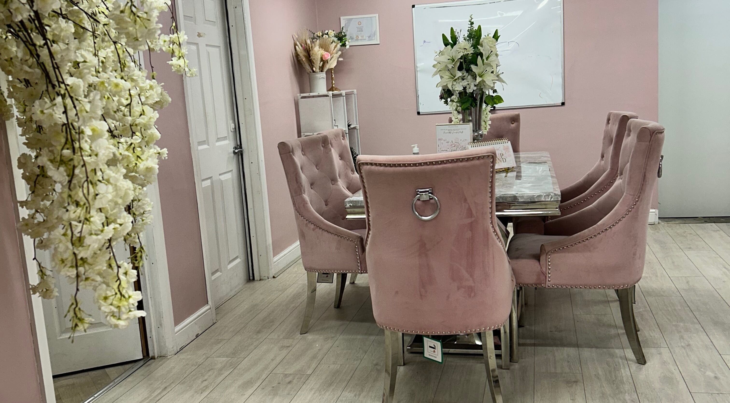 Luxurious pink meeting room at Rhilaxandrhivive, Barnsley, England, GB, featuring stylish seating and floral decor.