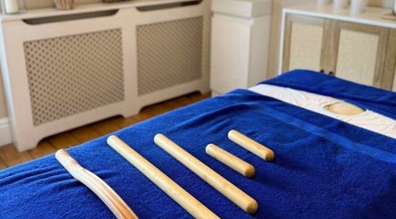 Bamboo massage tools on a blue towel at Sorelle Beauty House, Lytham St Annes, England, GB.
