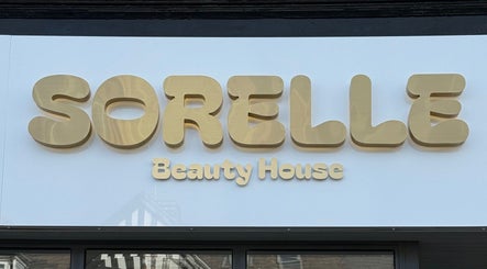 Elegant gold signage of Sorelle Beauty House in Lytham St Annes, England, GB.