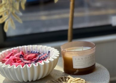Calming decor with candle and treats at Sorelle Beauty House, Lytham St Annes, England, GB.