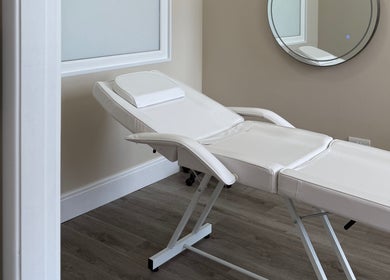Relaxing treatment room at Sorelle Beauty House in Lytham St Annes, England, GB with a plush white recliner.