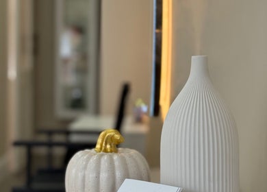 Elegant white vase and pumpkin decor at Sorelle Beauty House, Lytham St Annes, England, GB.