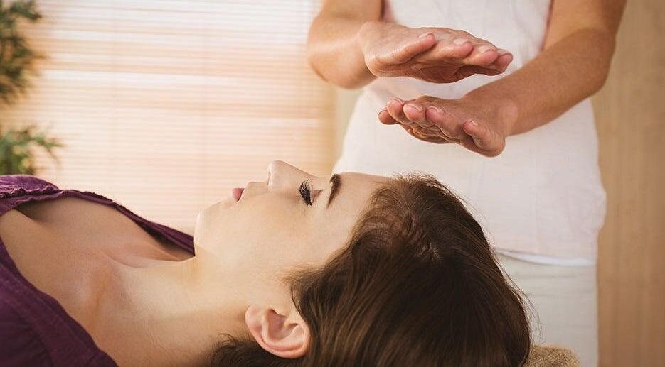 Therapist performing holistic massage at For Her Holistic & Therapeutic Massage in Edinburgh, Scotland, GB.