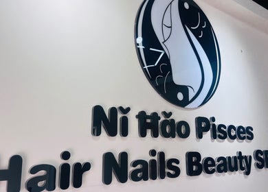 NǐĦǎo Pisces Nails Hair Beauty唐人美发 sign at L-imsida, MT, highlighting salon services.
