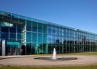 Vanessa's Makeup LTD at Botanica's sleek glass facade in Datchet, England, GB with a central fountain.