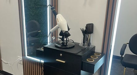 Modern styling station at Blo Me Ou', Blow Dry Bar in Jacksonville, Florida, US featuring sleek salon tools.