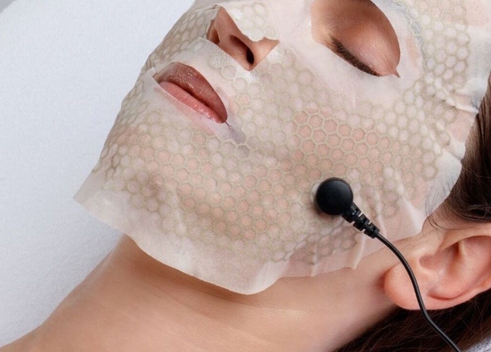 Client receiving facial treatment with mask at Revive Skin & Aesthetic Clinic, Abergavenny, Wales, GB.