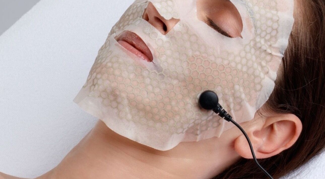 Client receiving facial treatment with mask at Revive Skin & Aesthetic Clinic, Abergavenny, Wales, GB.