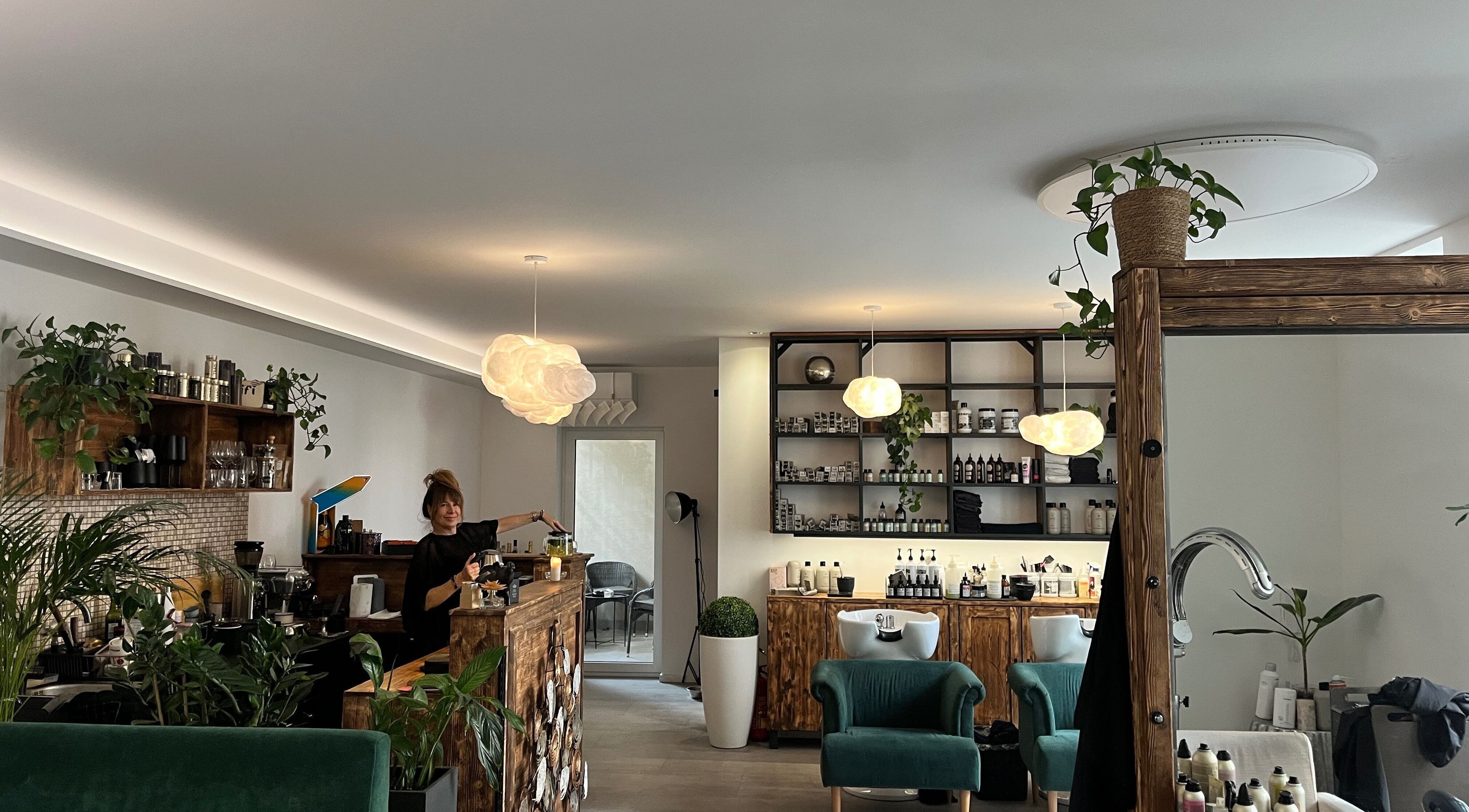 Stylish interior of CutzByMc (Fleur Studio) in Bratislavský Kraj, showcasing elegant decor and beauty products.