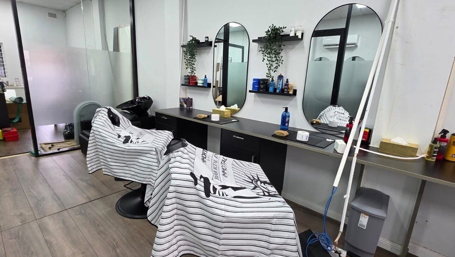 Modern salon chairs at Grooming Guru Unisex Salon in Ingleburn, New South Wales, AU.