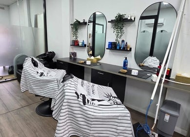 Modern salon chairs at Grooming Guru Unisex Salon in Ingleburn, New South Wales, AU.