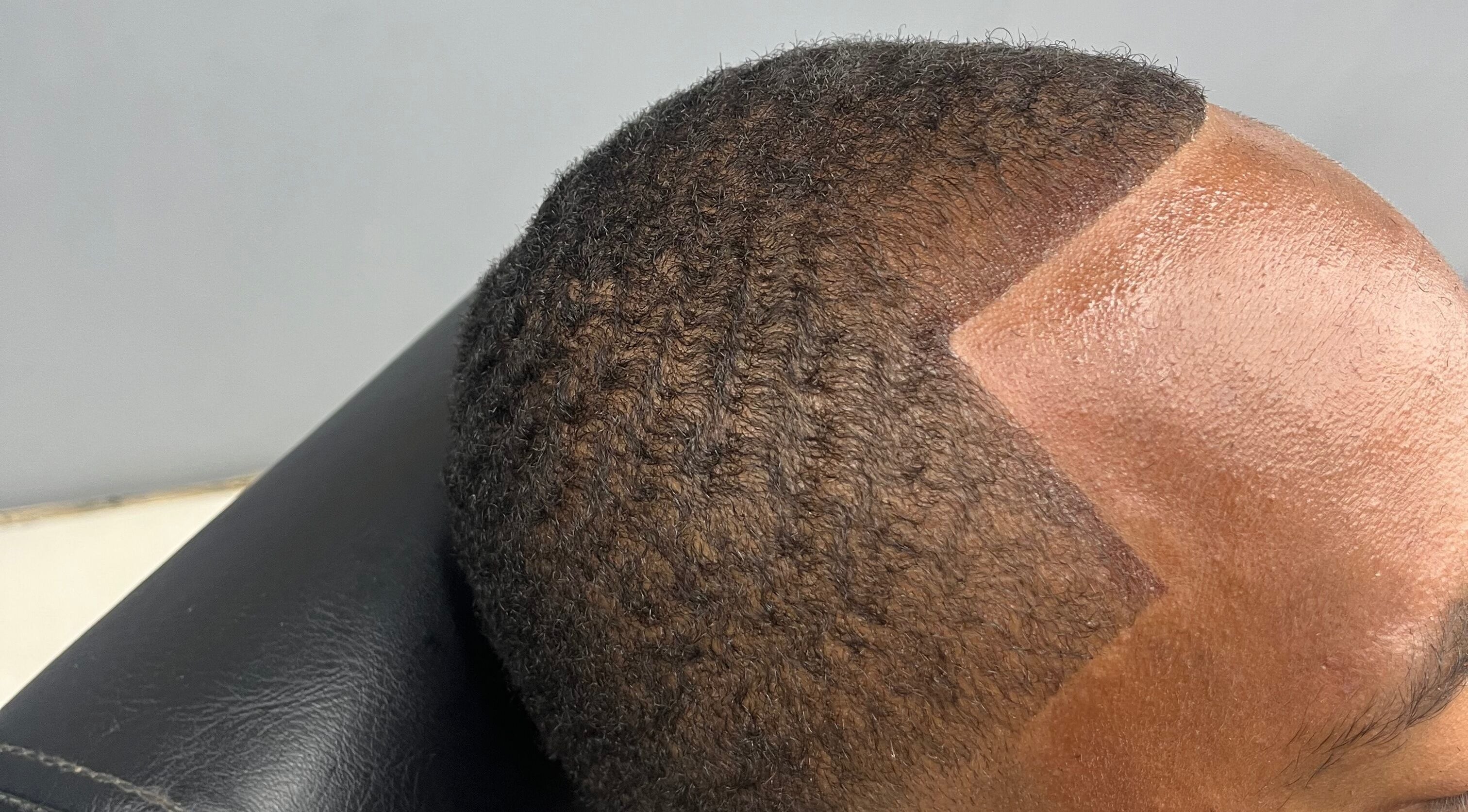 Close-up of a precise haircut at Royal Fades in Kralendijk, Bonaire, BQ, showcasing skilled barbering.