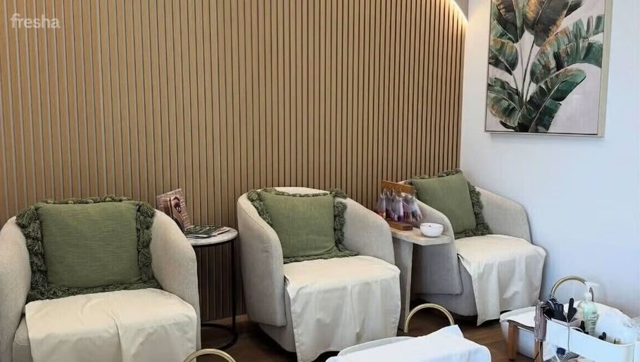 Elegant seating area at Savoy Beauty - Joondalup in Joondalup, Western Australia, AU with cozy armchairs.