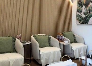 Elegant seating area at Savoy Beauty - Joondalup in Joondalup, Western Australia, AU with cozy armchairs.