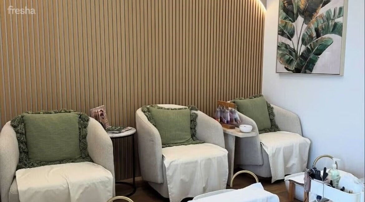 Elegant seating area at Savoy Beauty - Joondalup in Joondalup, Western Australia, AU with cozy armchairs.