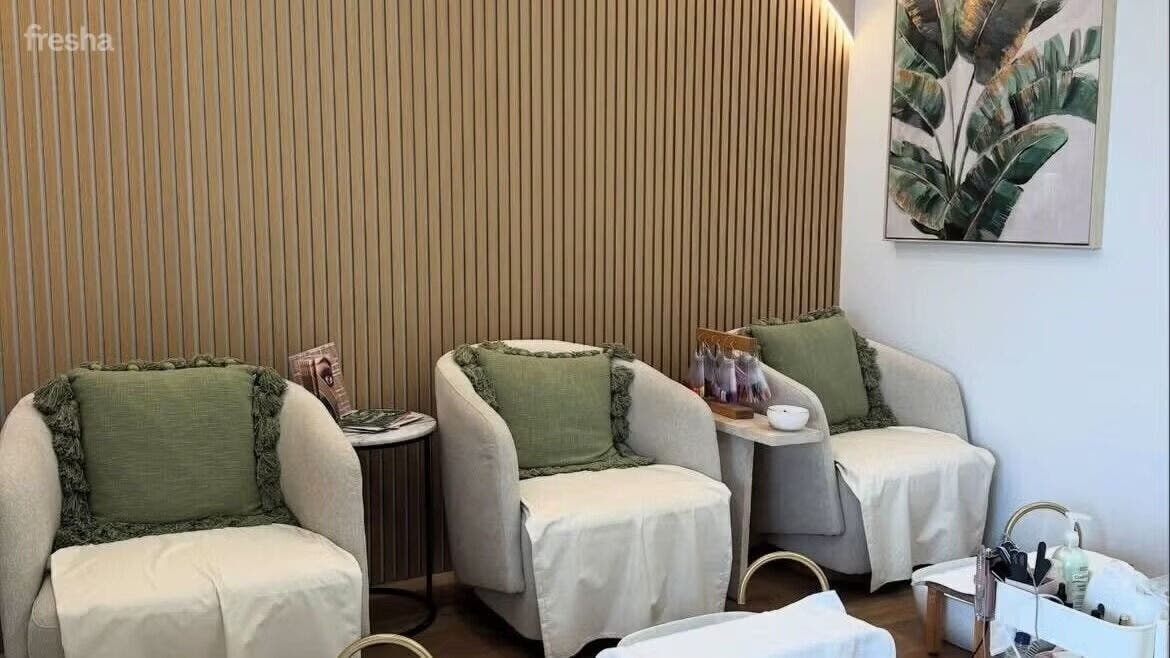 Elegant seating area at Savoy Beauty - Joondalup in Joondalup, Western Australia, AU with cozy armchairs.