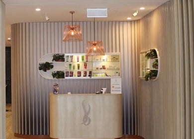 Chic reception area at Savoy Beauty - Joondalup, Joondalup, Western Australia, AU with modern decor and lighting.