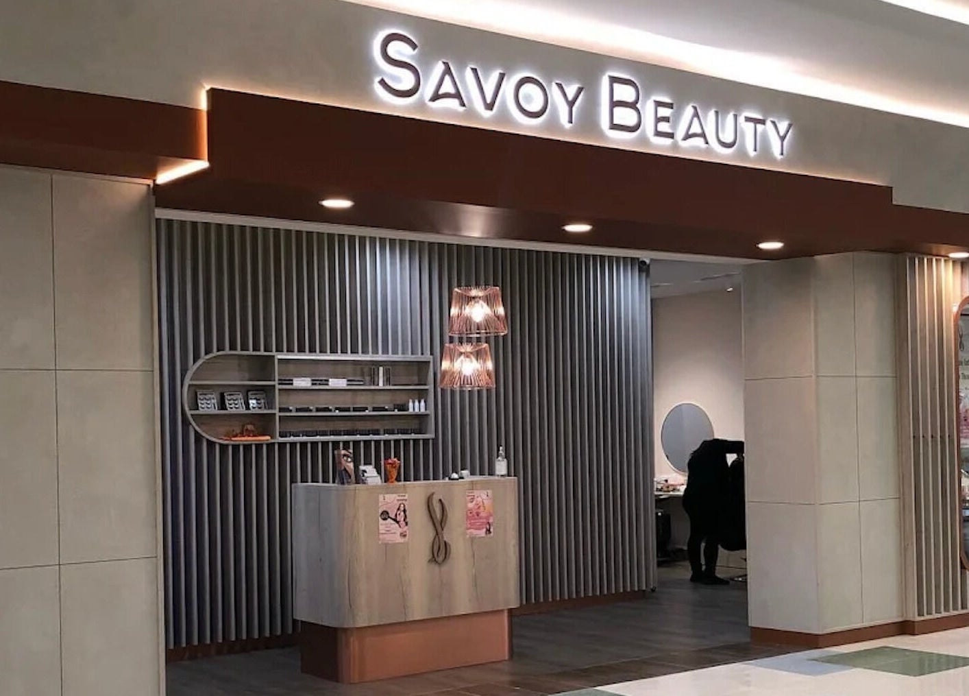 Entrance of Savoy Beauty - Warwick in Warwick, Western Australia, AU showcasing modern design and warm lighting.