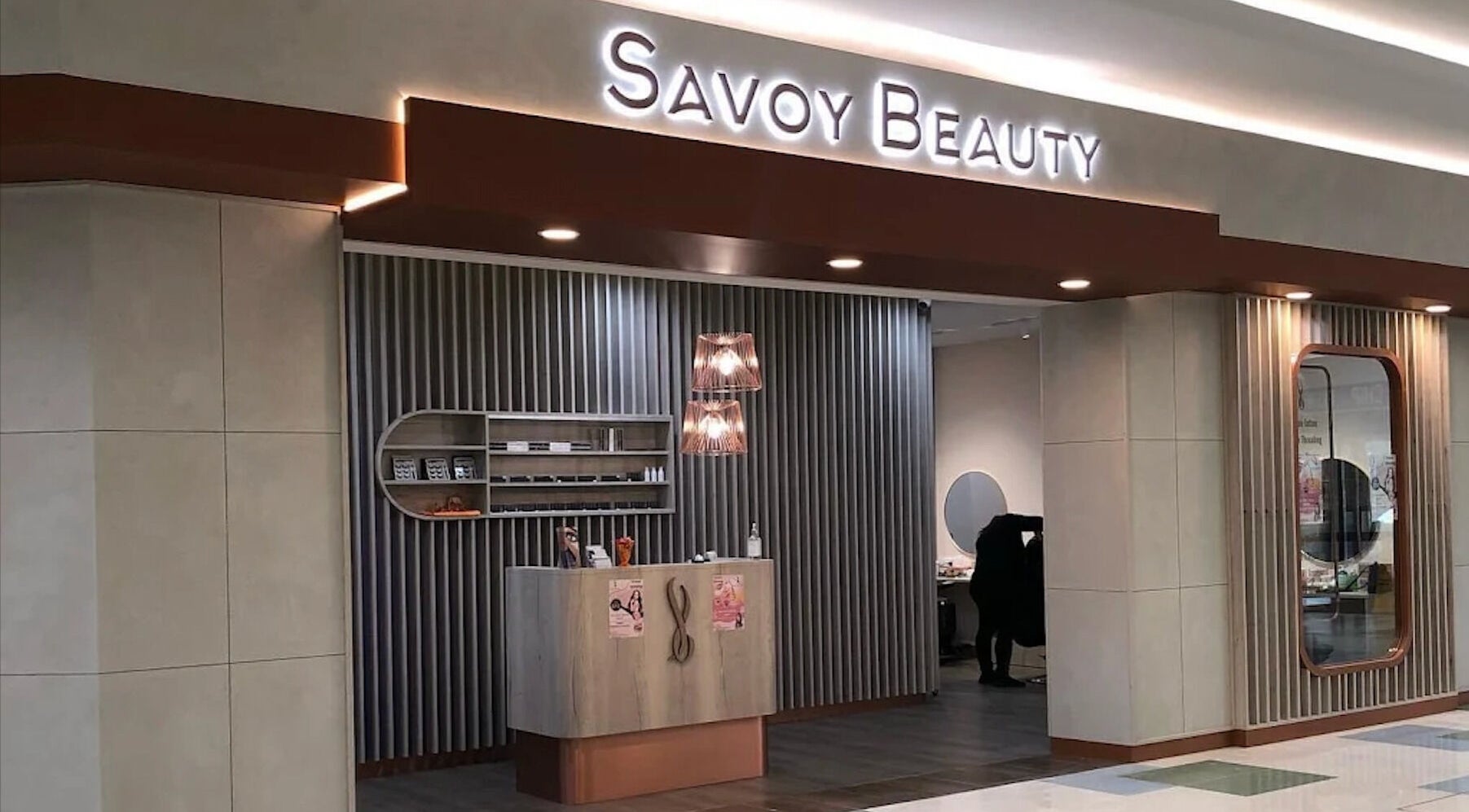 Entrance of Savoy Beauty - Warwick in Warwick, Western Australia, AU showcasing modern design and warm lighting.