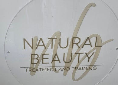 Elegant Natural Beauty logo at Wythenshawe, England, GB, showcasing treatment and training services.