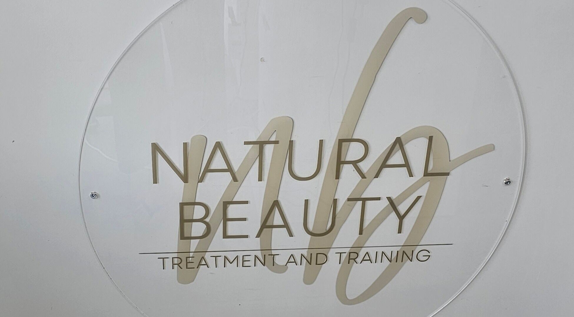Elegant Natural Beauty logo at Wythenshawe, England, GB, showcasing treatment and training services.