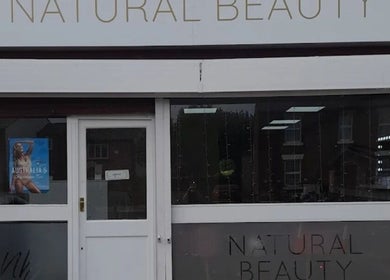 Front facade of Natural Beauty salon in Wythenshawe, England, GB, showcasing modern design and inviting entrance.
