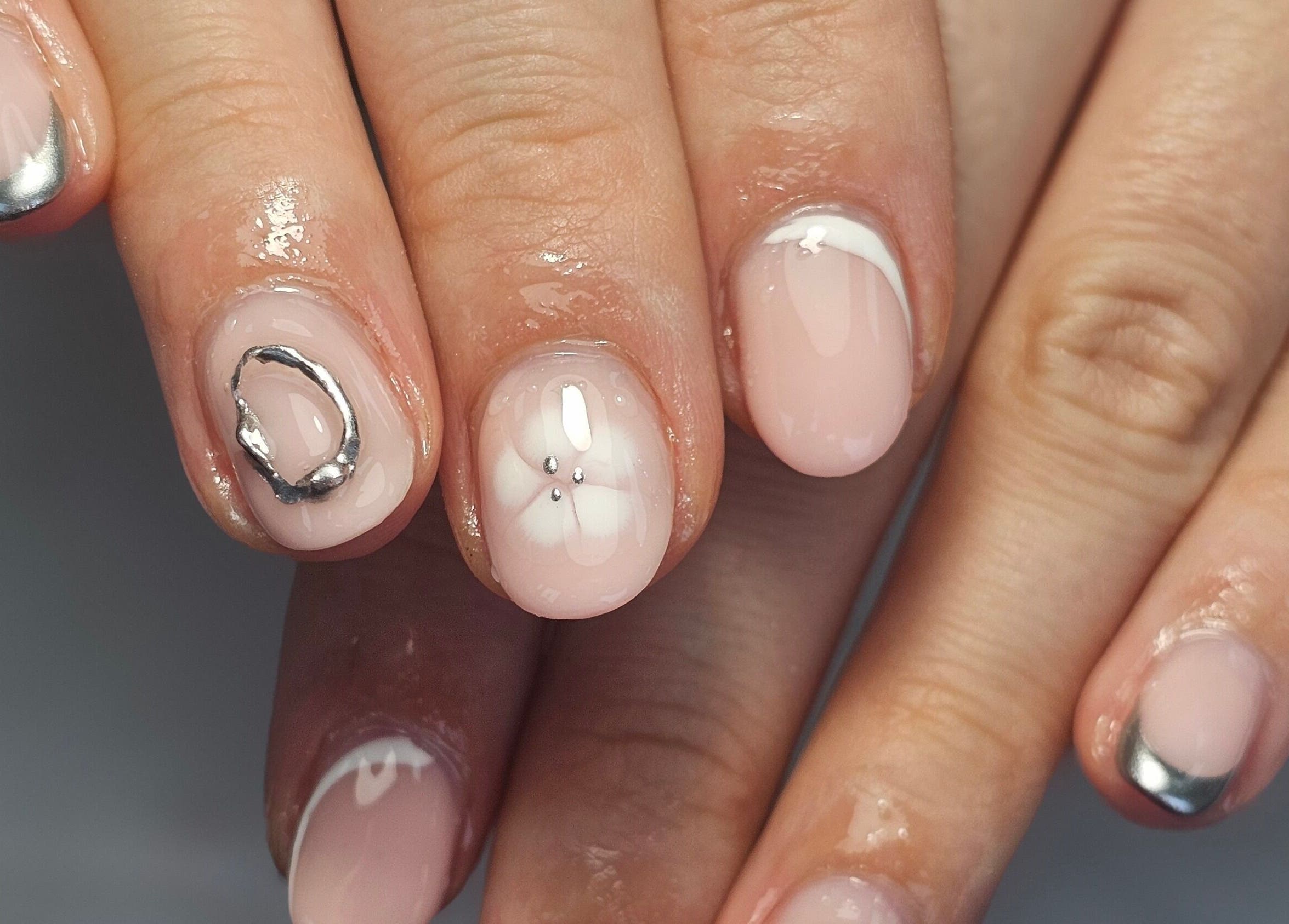 Elegant nail art featuring metallic accents at Natural Beauty, Wythenshawe, England, GB.