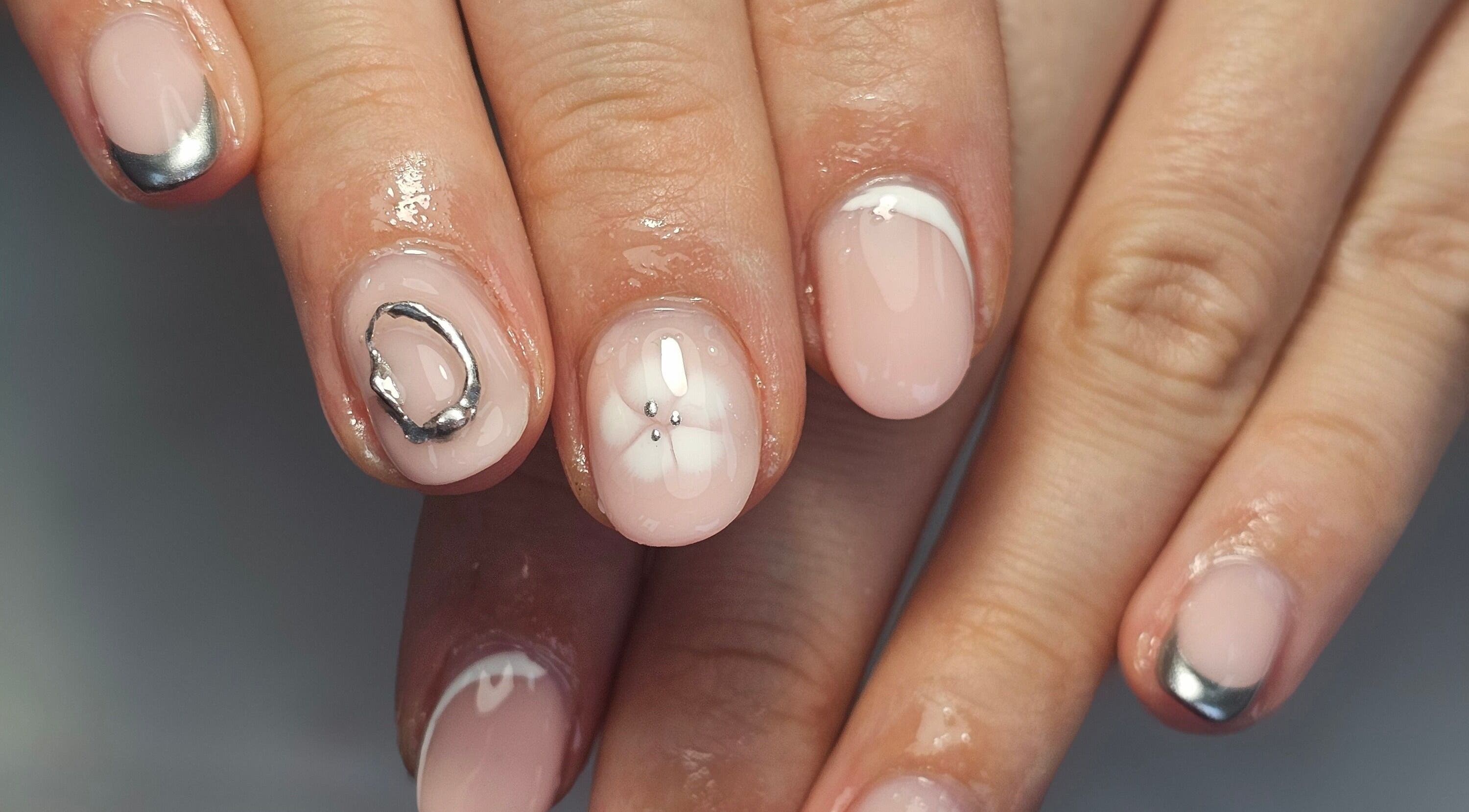 Elegant nail art featuring metallic accents at Natural Beauty, Wythenshawe, England, GB.