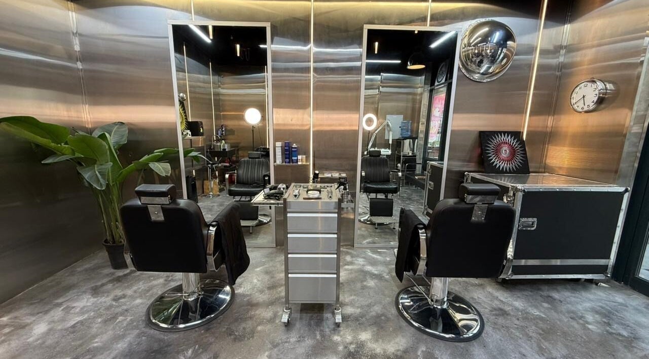 Interior of Dialan Gents Salon L.L.C in Dubai, AE, featuring sleek styling chairs and contemporary decor.