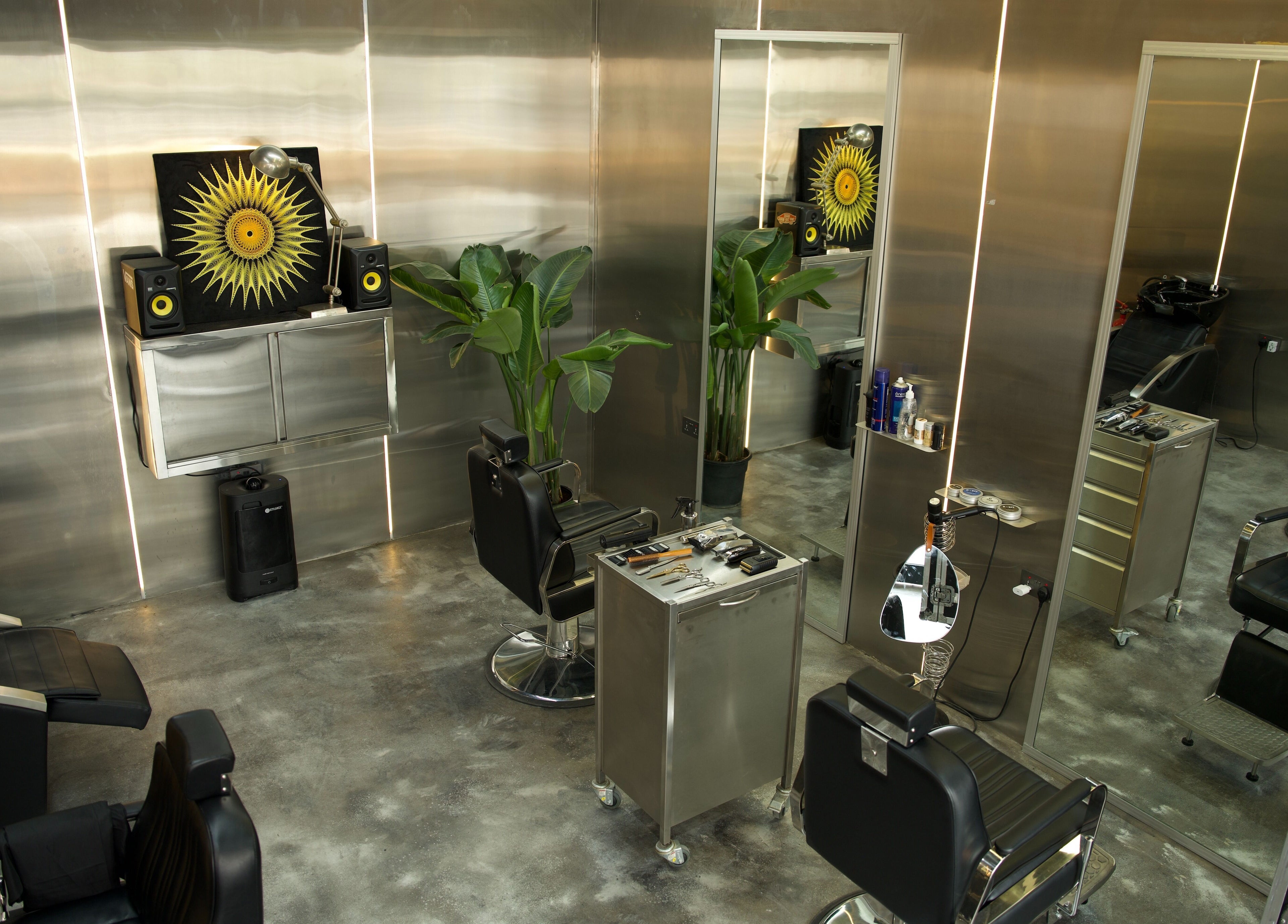 Modern interior of Dialan Gents Salon L.L.C in Dubai, AE. Stylish barber chairs and sleek decor.