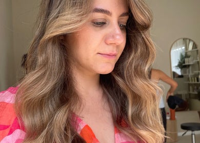 Woman with styled waves at Colour by Margarita in Primbee, New South Wales, AU.