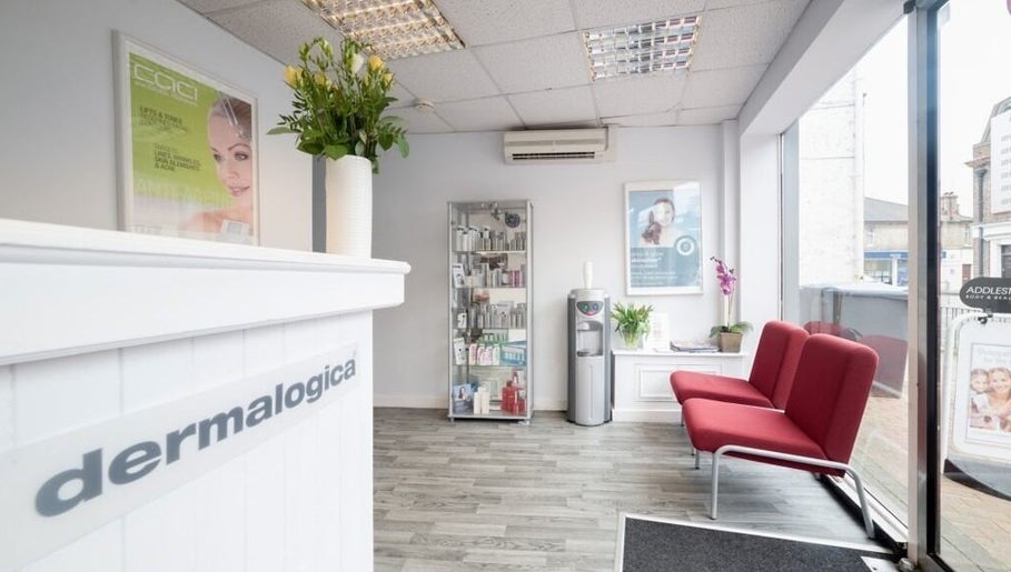 Reception area of Addlestone Therapy in Addlestone, England, GB with modern decor and welcoming seating.