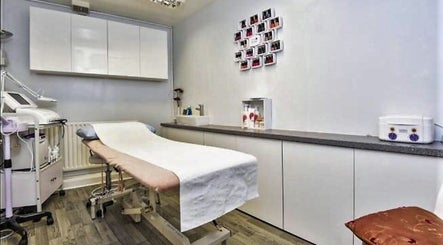 Modern therapy room at Addlestone Therapy, Addlestone, England, GB with spa bed and equipment.