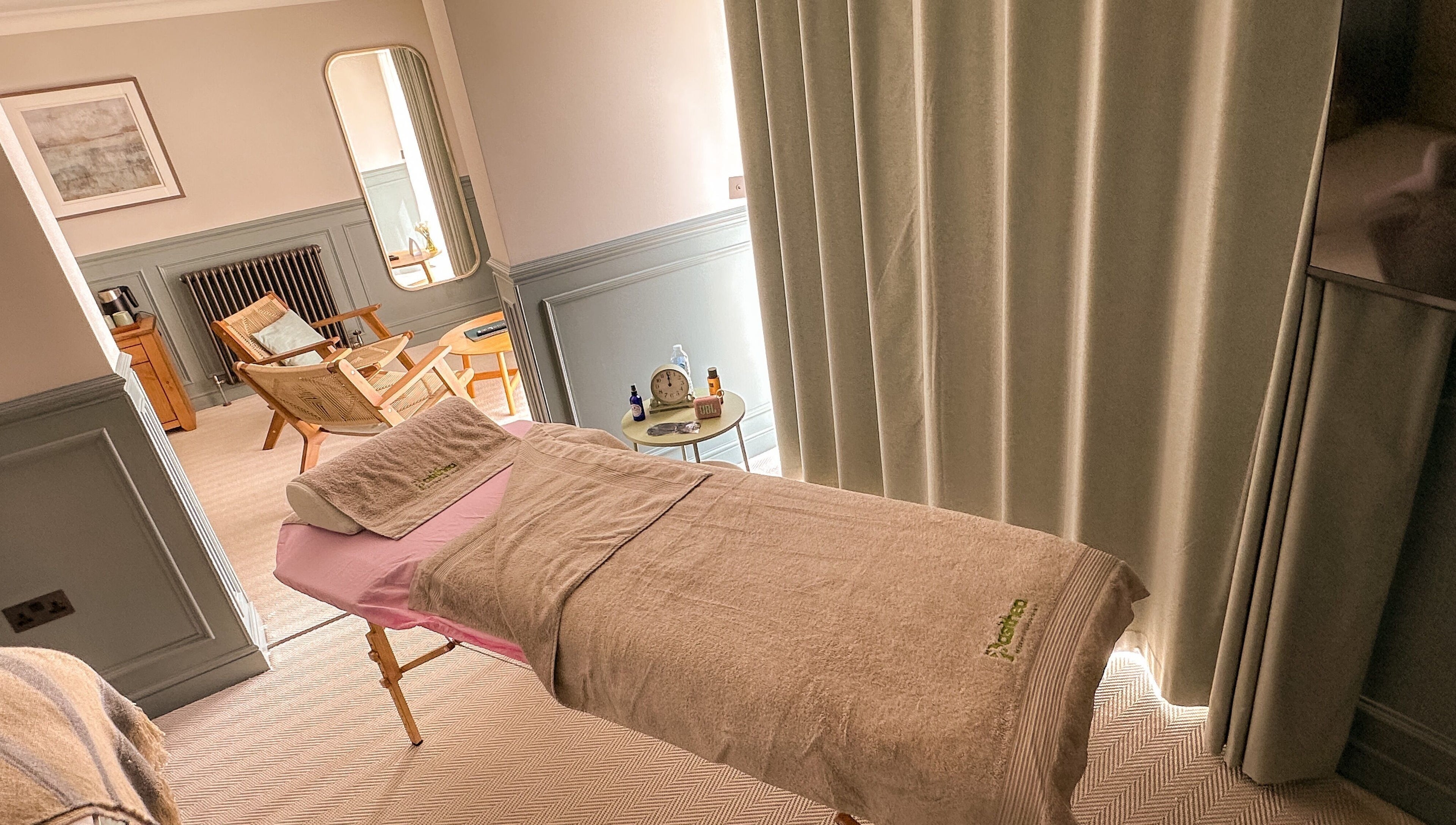 Relaxing treatment room at Pasithea Massage by Appointment, Ventnor, England, GB with comfortable décor.