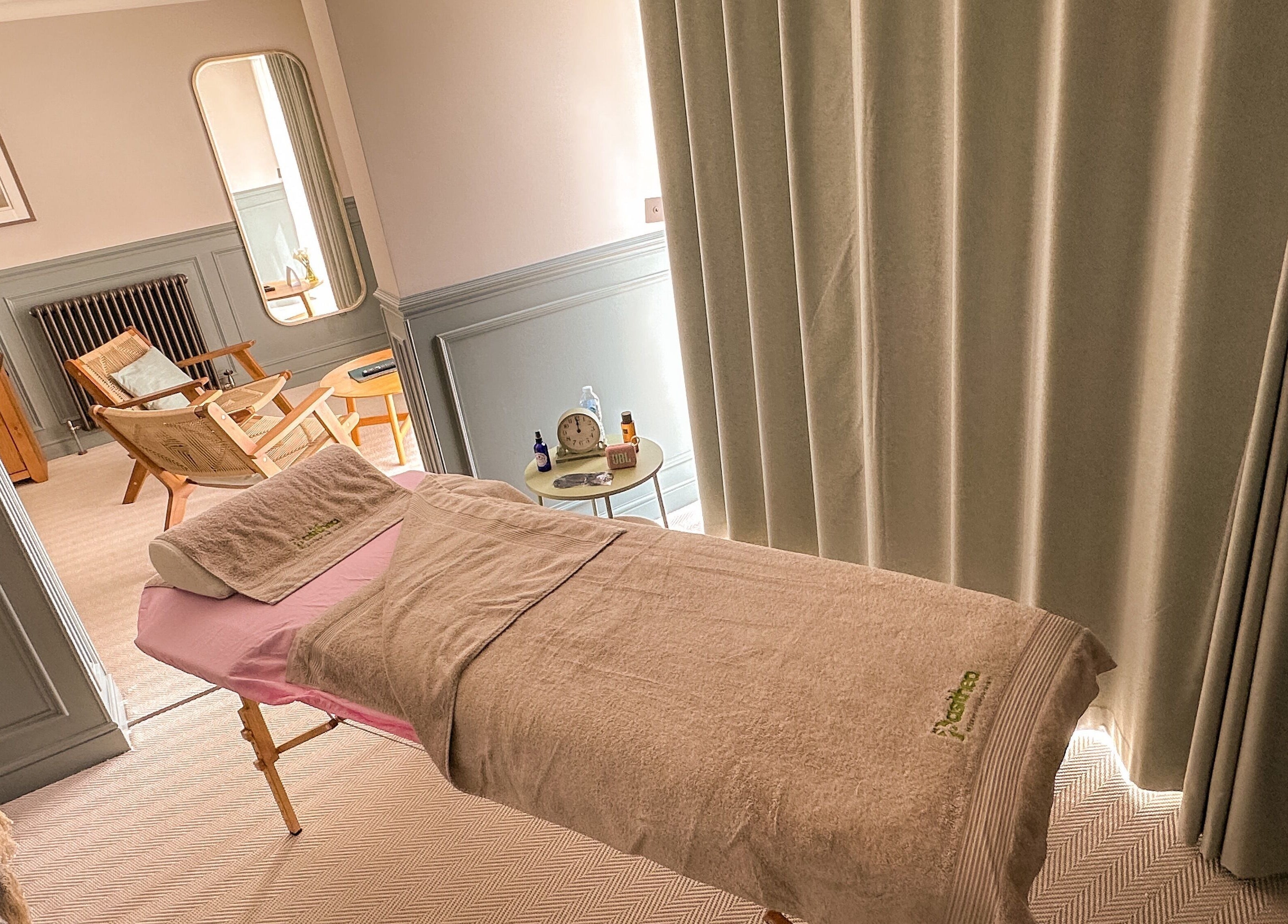 Relaxing treatment room at Pasithea Massage by Appointment, Ventnor, England, GB with comfortable décor.