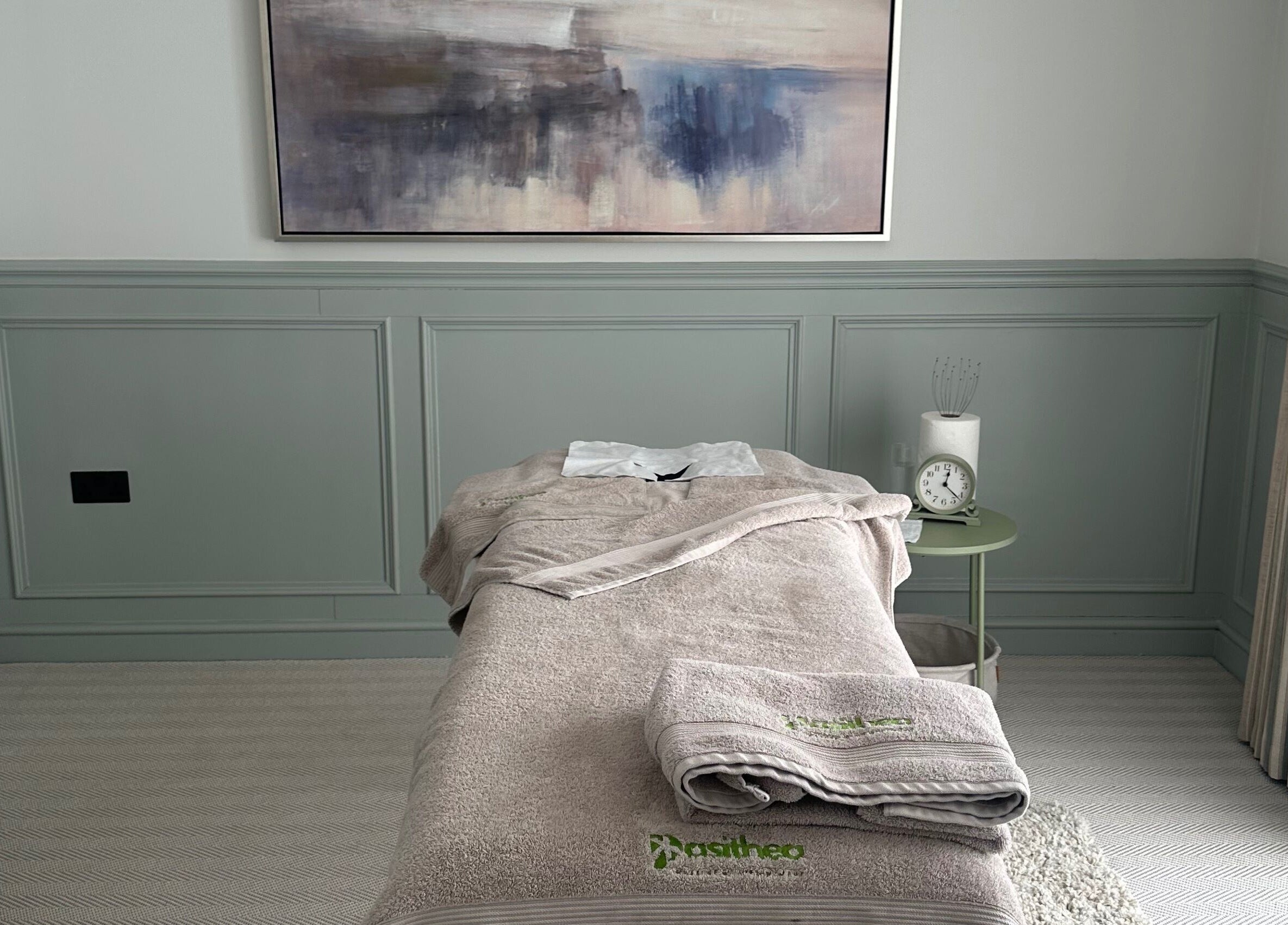 Relaxing massage table at Pasithea Massage by Appointment, Ventnor, England, GB, with soft lighting and calming decor.