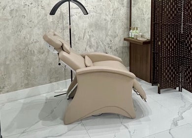 Luxurious reclining chair in Lala Simone Beauty, London, England, GB spa treatment room.
