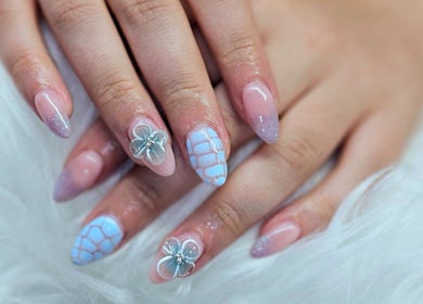 Delicate floral nail art at Dark Envy Nails in Swaffham, England, GB. Showcasing trendy design and style.