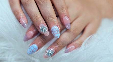 Delicate floral nail art at Dark Envy Nails in Swaffham, England, GB. Showcasing trendy design and style.