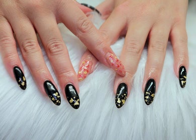 Chic black and gold nail art at Dark Envy Nails, Swaffham, England, GB, showcasing stylish design.