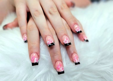 Chic floral nail art manicure at Dark Envy Nails, Swaffham, England, GB. Elegant pink and black design.