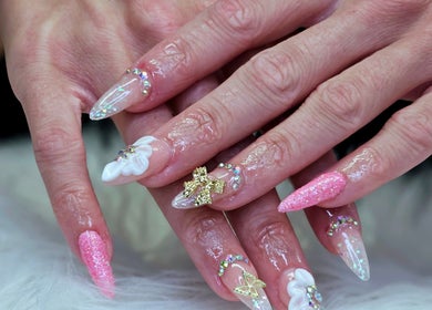 Intricate nail design at Dark Envy Nails, Swaffham, England, GB with pink glitter and 3D embellishments.