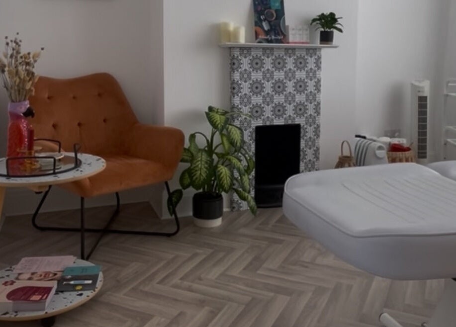Inviting treatment room at Fresh Faced in Grimsby, England, GB, featuring a plush chair and elegant decor.